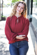 Load image into Gallery viewer, Feeling Femme Off Burgundy Frilled Edge V Neck Tie Top
